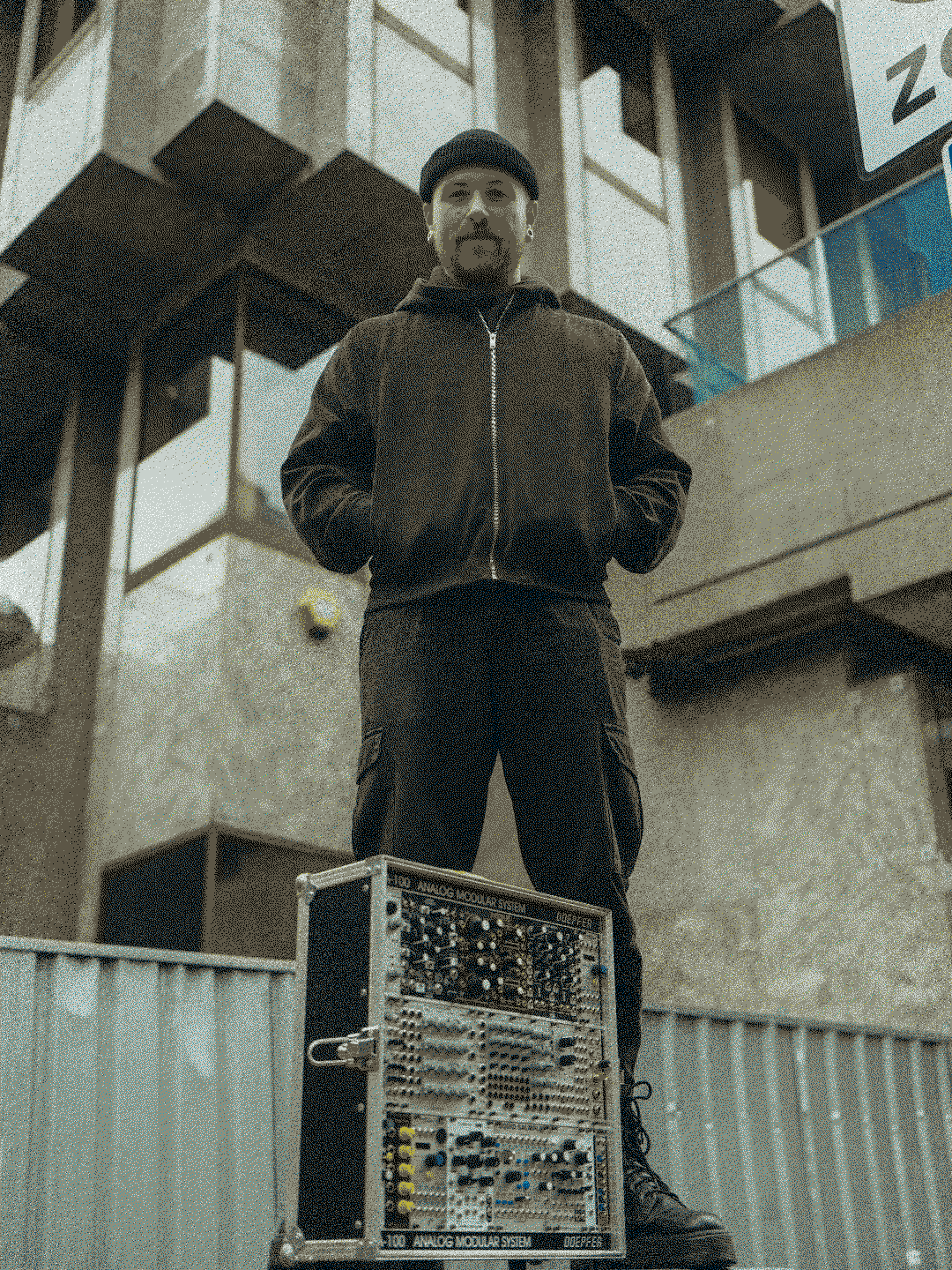 Jake Mehew posing with modular synth